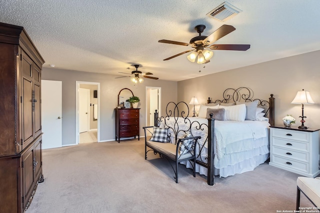 2334 Creekside Bnd, San Antonio, TX 78259 - bedroom featuring light carpet, a textured ceiling, and a ceiling fan