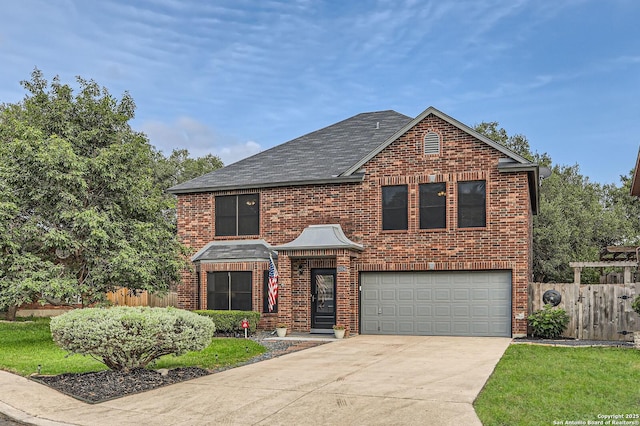 2334 Creekside Bnd, San Antonio, TX 78259 - traditional-style house with driveway, an attached garage, brick siding, and a shingled roof