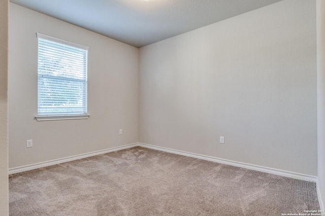 5614 Burr Blf, San Antonio, TX 78266 - spare room featuring carpet floors and baseboards
