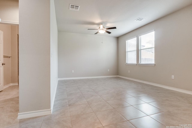 5614 Burr Blf, San Antonio, TX 78266 - empty room featuring a ceiling fan, light tile patterned flooring, and baseboards