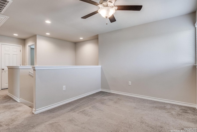 5614 Burr Blf, San Antonio, TX 78266 - unfurnished room with light carpet, ceiling fan, recessed lighting, attic access, and baseboards