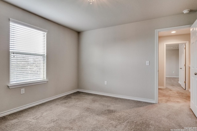 5614 Burr Blf, San Antonio, TX 78266 - carpeted empty room with baseboards and a smoke detector