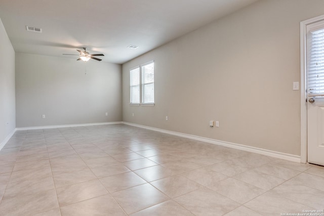 5614 Burr Blf, San Antonio, TX 78266 - unfurnished room with ceiling fan, light tile patterned floors, and baseboards