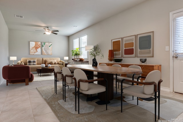 5614 Burr Blf, San Antonio, TX 78266 - dining area with light tile patterned flooring, a ceiling fan, and baseboards