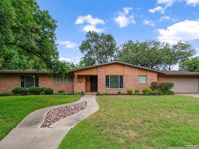 110 Wyndale, San Antonio, TX 78209 - ranch-style home with brick siding, an attached garage, and a front yard