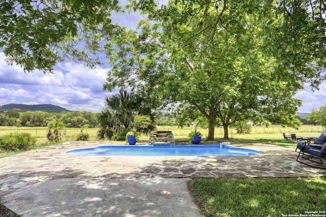 367 Diamond J Rd N, Pipe Creek, TX 78063 - view of pool with a patio and a mountain view