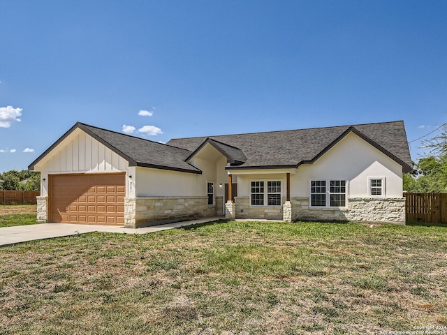 8501 Utopia Blvd, Selma, TX 78154 - view of front of home with stone siding, an attached garage, concrete driveway, stucco siding, and board and batten siding