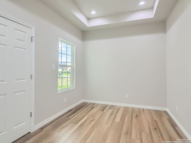 8501 Utopia Blvd, Selma, TX 78154 - empty room featuring light wood finished floors, baseboards, recessed lighting, and a raised ceiling