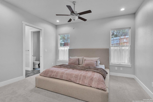26406 Bubbling Brk, San Antonio, TX 78260 - bedroom featuring multiple windows, ensuite bath, recessed lighting, carpet, and baseboards