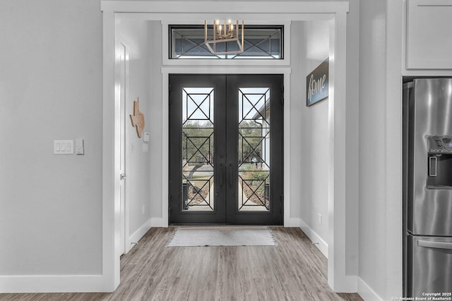 26406 Bubbling Brk, San Antonio, TX 78260 - foyer entrance with baseboards, wood finished floors, french doors, and a chandelier