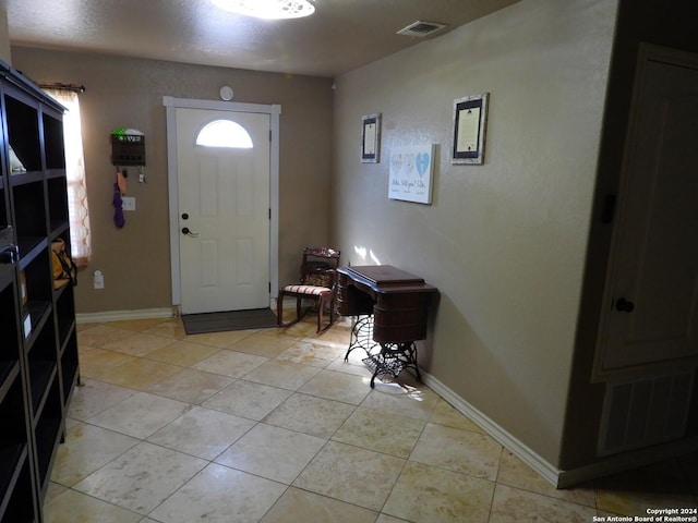 155 Scenic Cir, Lakehills, TX 78063 - entryway featuring light tile patterned floors and baseboards
