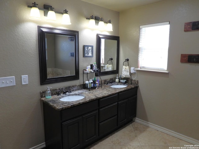 155 Scenic Cir, Lakehills, TX 78063 - full bath featuring double vanity, baseboards, and tile patterned floors