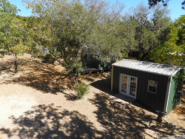 155 Scenic Cir, Lakehills, TX 78063 - view of outdoor structure with french doors