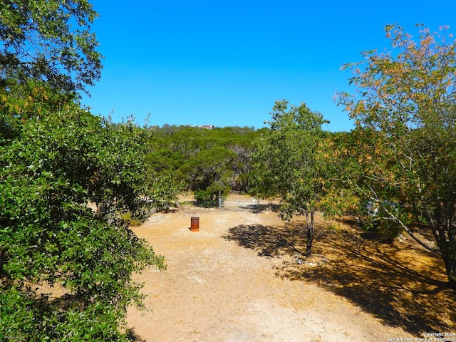 155 Scenic Cir, Lakehills, TX 78063 - view of yard featuring a rural view