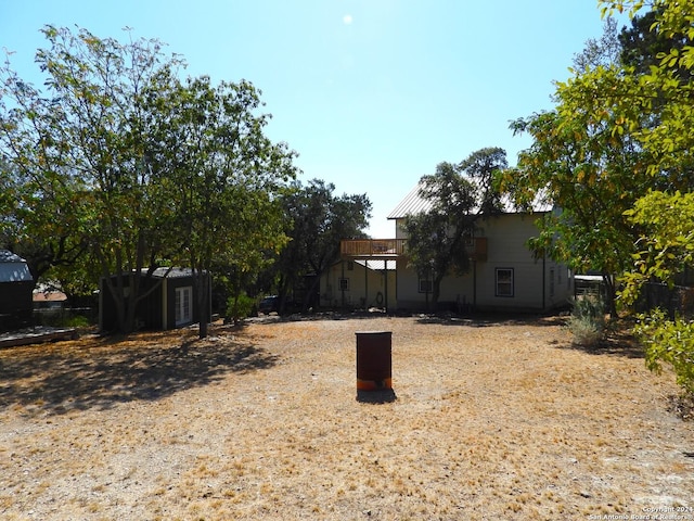 155 Scenic Cir, Lakehills, TX 78063 - view of yard with a wooden deck