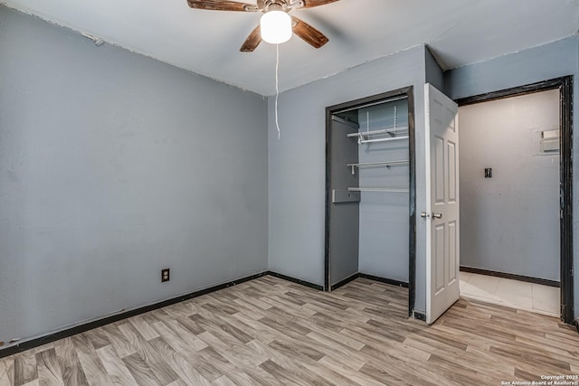 2927 Lasses, San Antonio, TX 78223 - unfurnished bedroom featuring light wood-style floors, a closet, a ceiling fan, and baseboards