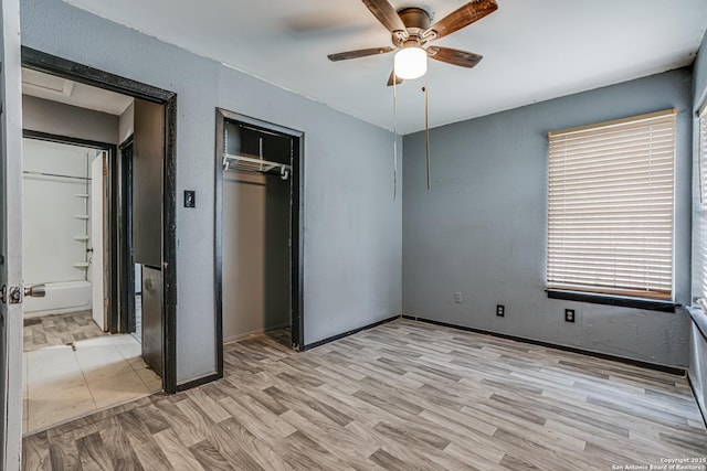 2927 Lasses, San Antonio, TX 78223 - unfurnished bedroom with a closet, light wood-type flooring, ceiling fan, and baseboards