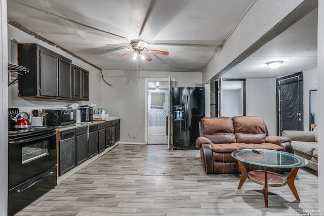 2927 Lasses, San Antonio, TX 78223 - living room featuring ceiling fan, light wood finished floors, and baseboards