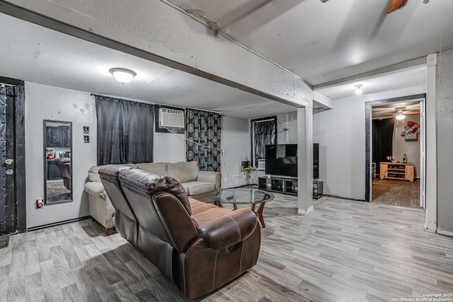 2927 Lasses, San Antonio, TX 78223 - living area with a wall unit AC and light wood-style flooring