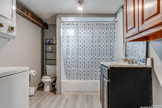 2927 Lasses, San Antonio, TX 78223 - bathroom featuring toilet, vanity, wood finished floors, shower / bath combo, and washer / clothes dryer