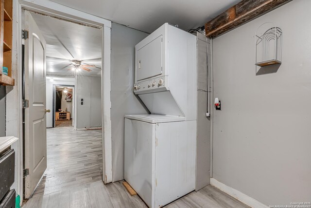 2927 Lasses, San Antonio, TX 78223 - laundry room with stacked washing machine and dryer, light wood-style floors, and a ceiling fan