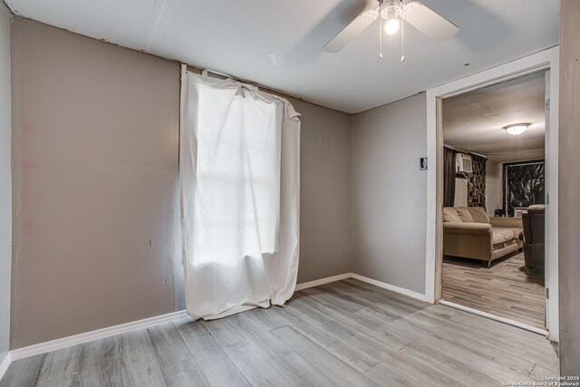 2927 Lasses, San Antonio, TX 78223 - unfurnished room featuring baseboards, wood finished floors, and a ceiling fan
