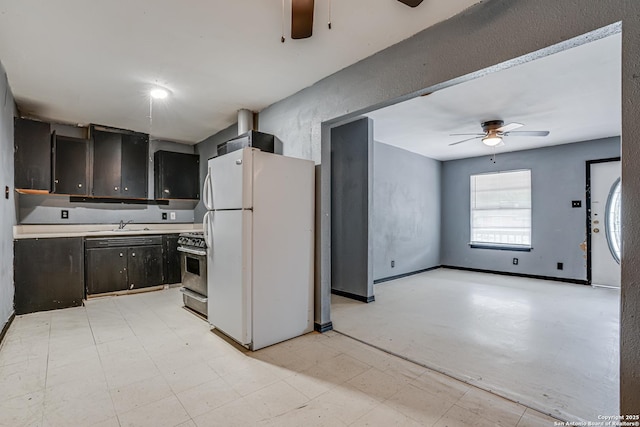 2927 Lasses, San Antonio, TX 78223 - kitchen featuring freestanding refrigerator, a ceiling fan, stainless steel range with gas cooktop, light countertops, and light floors