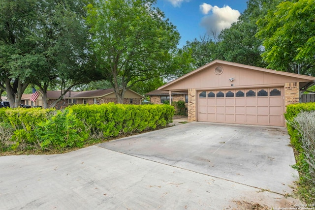 210 Cardinal, New Braunfels, TX 78130 - single story home with brick siding and driveway