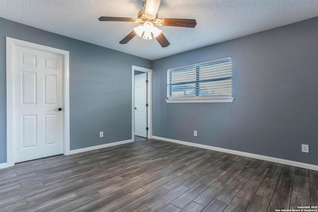 210 Cardinal, New Braunfels, TX 78130 - unfurnished bedroom featuring wood finished floors, a textured ceiling, baseboards, and a ceiling fan