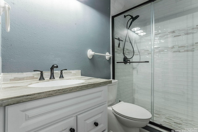 210 Cardinal, New Braunfels, TX 78130 - bathroom with vanity, a shower stall, toilet, and a textured wall