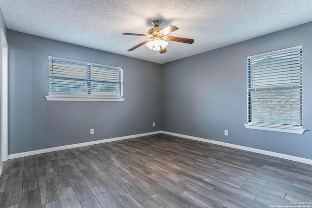 210 Cardinal, New Braunfels, TX 78130 - spare room featuring ceiling fan, plenty of natural light, dark wood-style flooring, and a textured ceiling