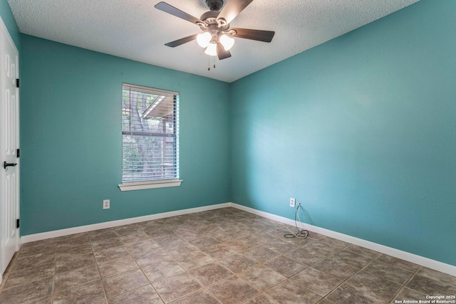 210 Cardinal, New Braunfels, TX 78130 - spare room with a textured ceiling, ceiling fan, and baseboards