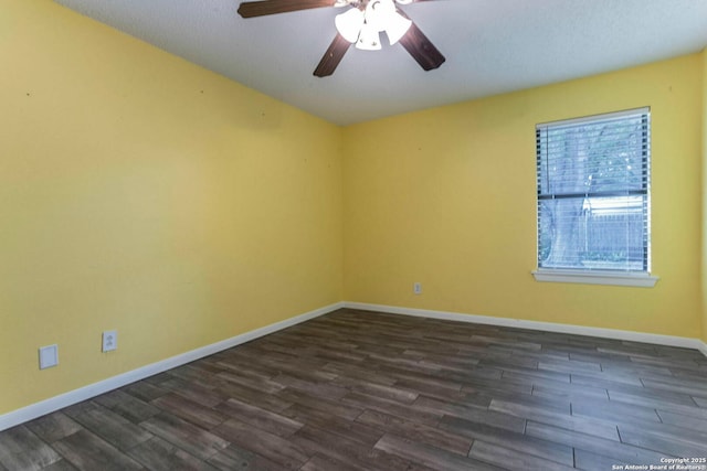 210 Cardinal, New Braunfels, TX 78130 - empty room featuring dark wood finished floors, a ceiling fan, and baseboards