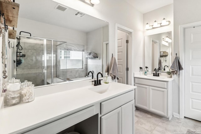 4902 Oxbow Bnd, Saint Hedwig, TX 78152 - full bath with vanity, a shower stall, tile patterned floors, and a bath