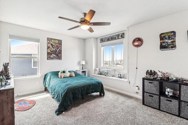 4902 Oxbow Bnd, Saint Hedwig, TX 78152 - carpeted bedroom with baseboards and ceiling fan