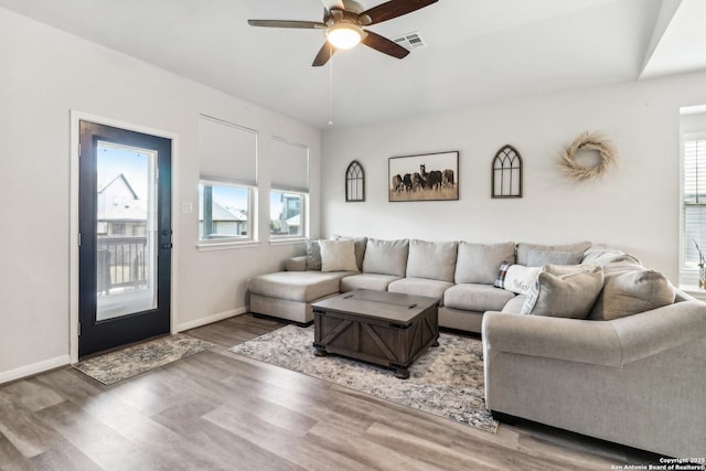 4902 Oxbow Bnd, Saint Hedwig, TX 78152 - living room featuring a ceiling fan, healthy amount of natural light, wood finished floors, and baseboards