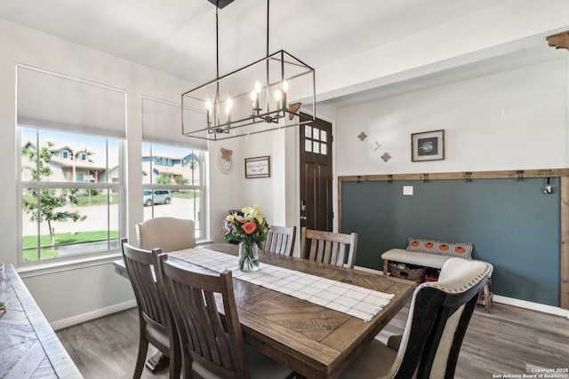 4902 Oxbow Bnd, Saint Hedwig, TX 78152 - dining space featuring a chandelier, baseboards, and wood finished floors