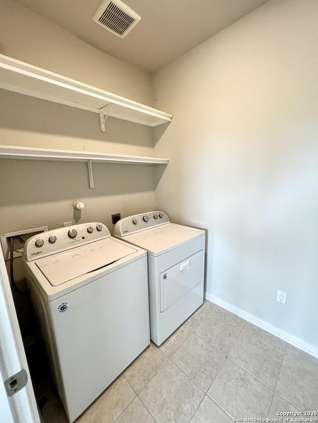 4823 Cambridge Park, Converse, TX 78109 - washroom with washing machine and dryer, light tile patterned flooring, and baseboards