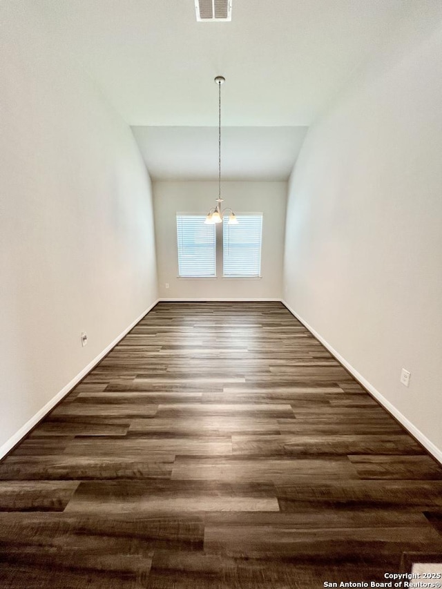 4823 Cambridge Park, Converse, TX 78109 - unfurnished dining area with a chandelier, dark wood finished floors, and baseboards
