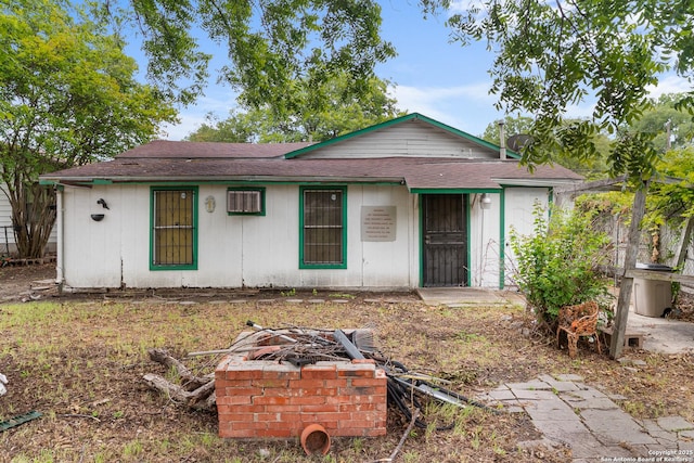 213 Hosack, San Antonio, TX 78211 - view of front of home featuring a fire pit and a shingled roof