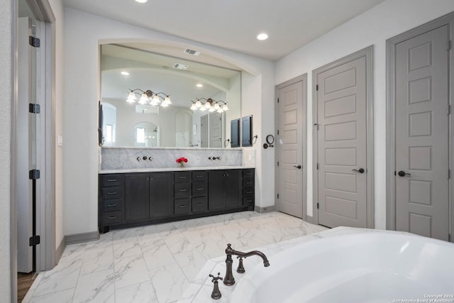 1132 Towhee Trl, New Braunfels, TX 78132 - full bathroom featuring double vanity, a bathtub, marble look tile flooring, baseboards, and recessed lighting