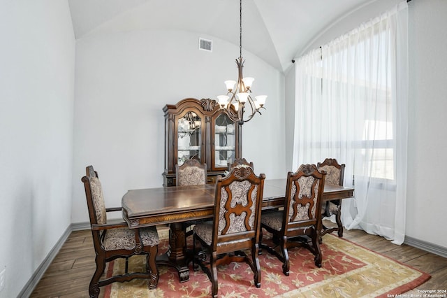1132 Towhee Trl, New Braunfels, TX 78132 - dining area featuring a chandelier, baseboards, wood finished floors, and lofted ceiling