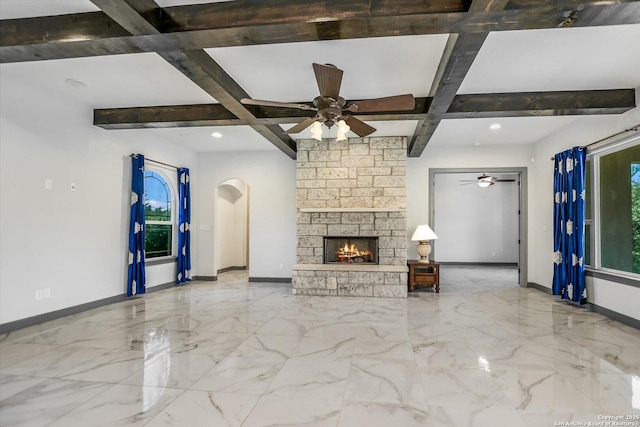 427 Bella Montagna Cir, Austin, TX 78734 - unfurnished living room featuring coffered ceiling, a ceiling fan, baseboards, beamed ceiling, and arched walkways