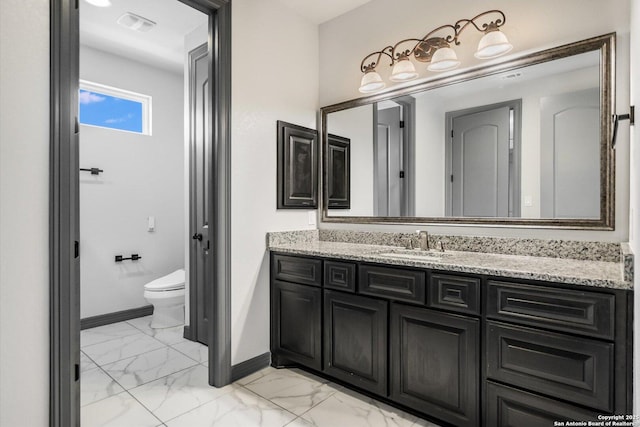 427 Bella Montagna Cir, Austin, TX 78734 - bathroom featuring baseboards, marble look tile flooring, vanity, and toilet