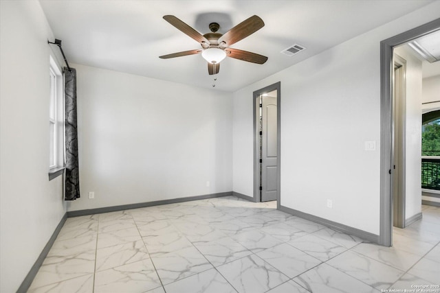 427 Bella Montagna Cir, Austin, TX 78734 - unfurnished room with light marble finish flooring, baseboards, and a ceiling fan