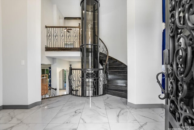 427 Bella Montagna Cir, Austin, TX 78734 - entryway featuring baseboards, arched walkways, and marble finish floors