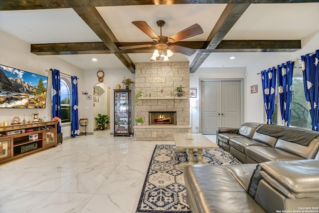 427 Bella Montagna Cir, Austin, TX 78734 - living room with beam ceiling, a ceiling fan, a fireplace, recessed lighting, and light marble finish floors