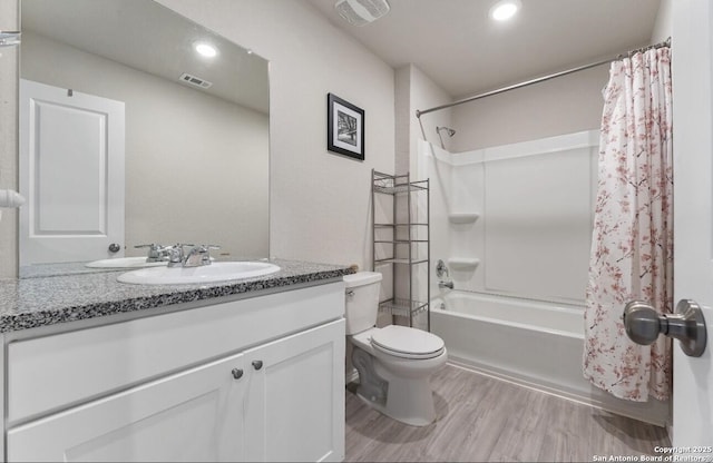 734 Ambush Rdg, San Antonio, TX 78219 - bathroom with toilet, vanity, shower / bath combination with curtain, wood finished floors, and recessed lighting