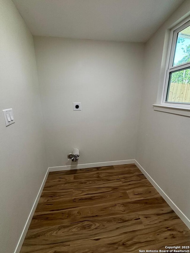 715 Sumner, San Antonio, TX 78209 - laundry room featuring hookup for an electric dryer, wood finished floors, and baseboards