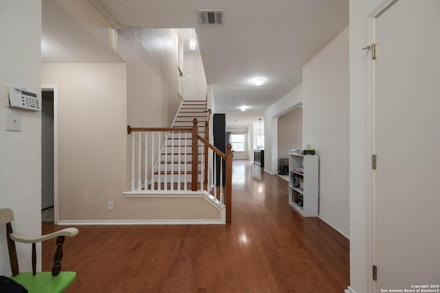 4706 Granite Shls, San Antonio, TX 78244 - corridor with wood finished floors, baseboards, and stairs